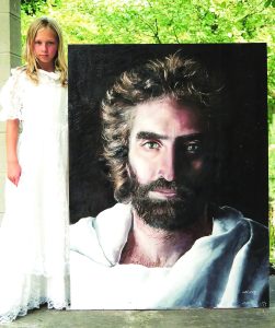 Akiane with picture of Jesus | Official Akiane Gallery