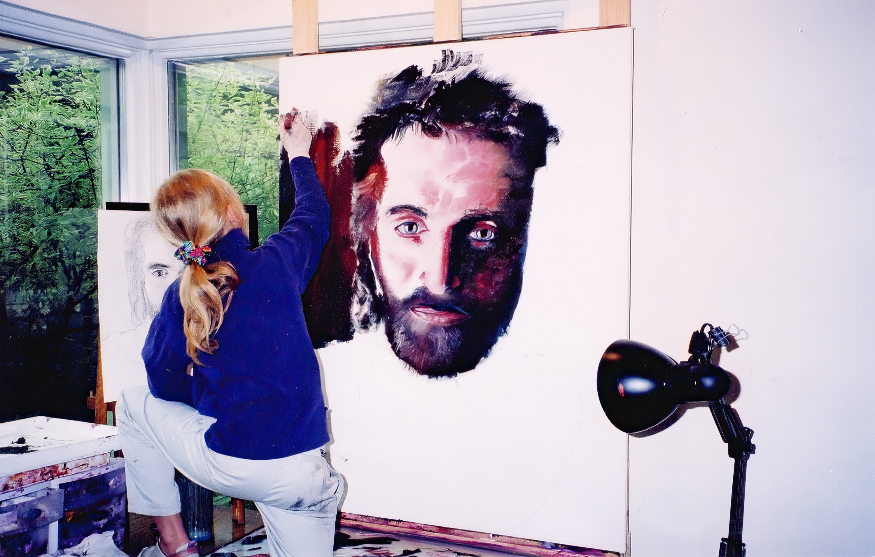 Akiane painting the hair around the face