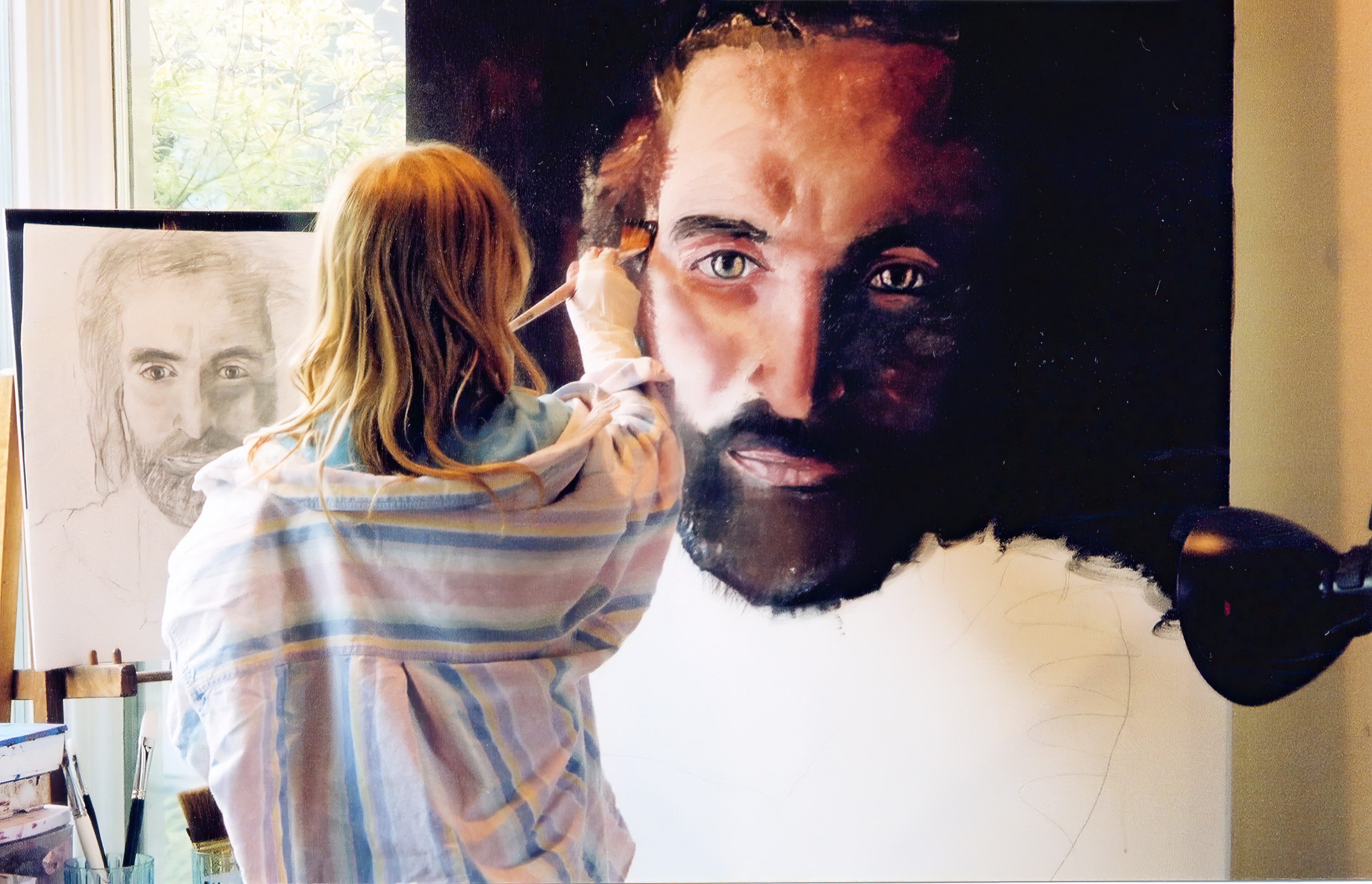 Akiane working on the eye, the background turning dark