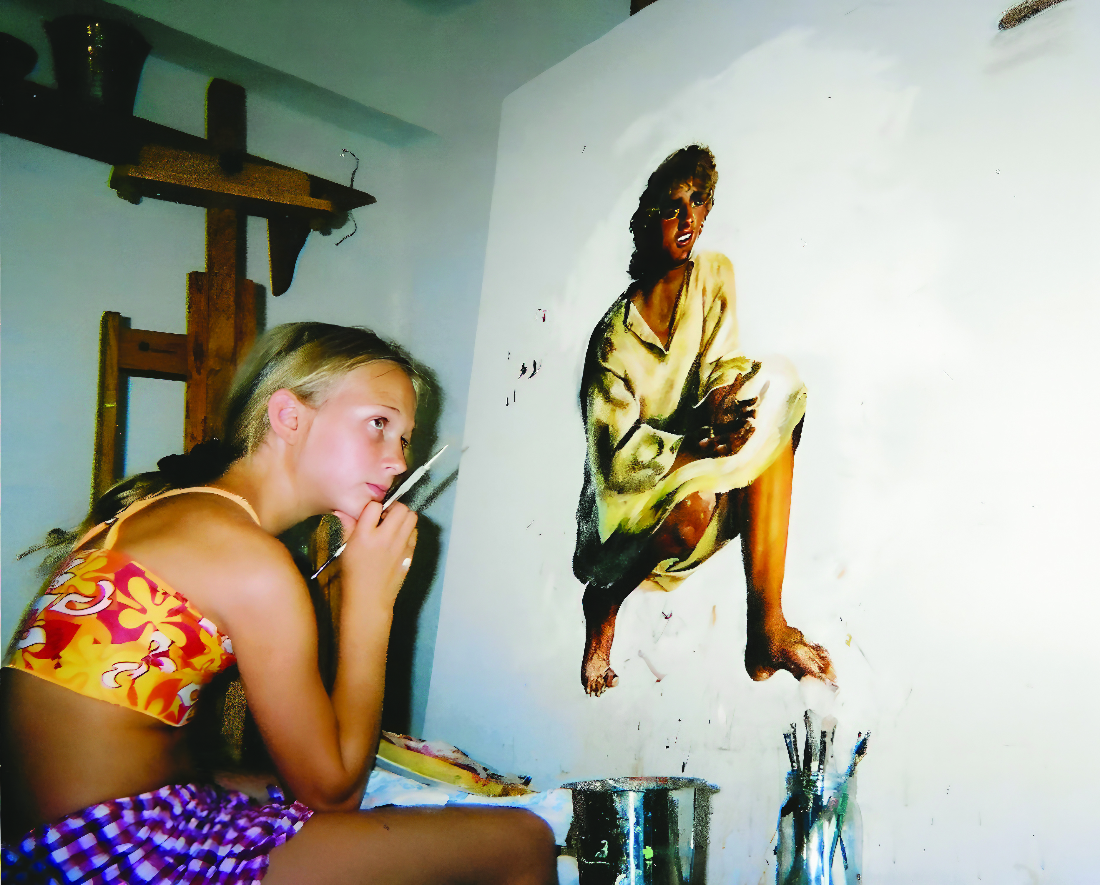 Akiane at age ten studying her painting Jesus, The Missing Years